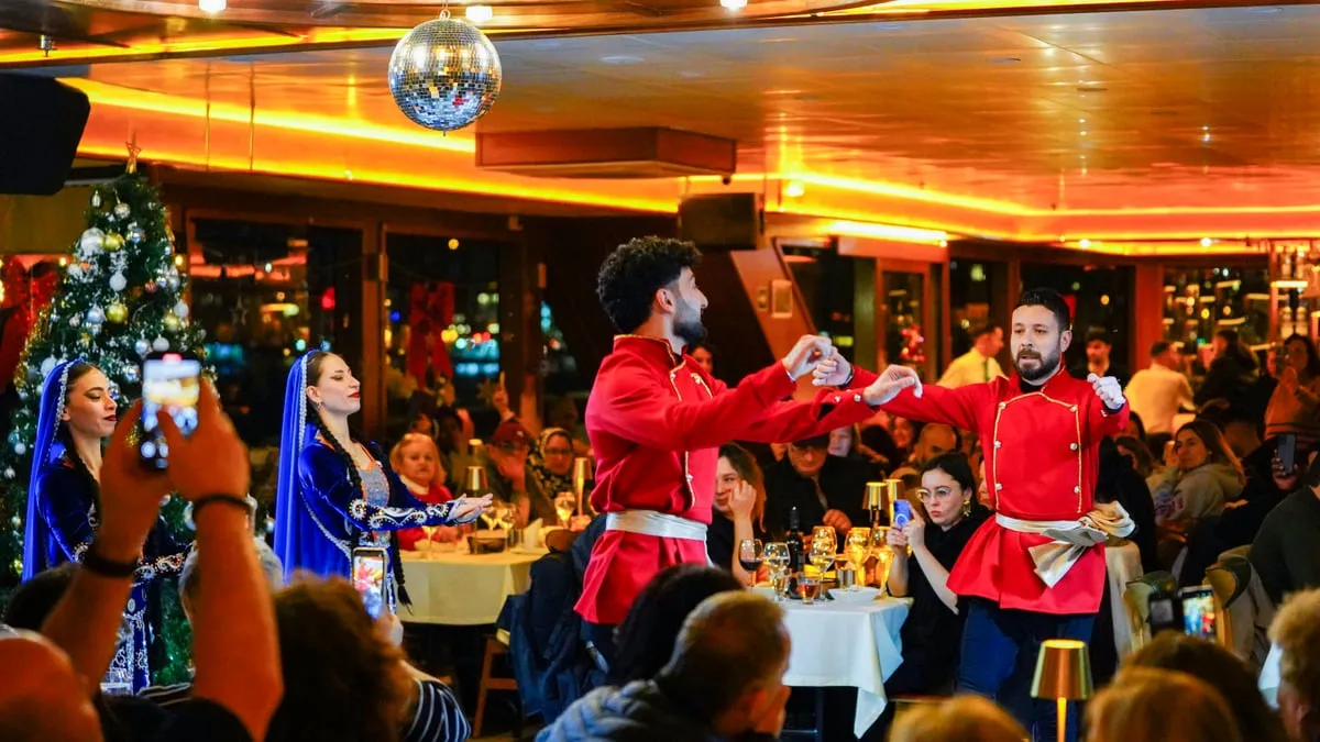 Caucasian Gandagan dancers in red costume performing on the AMOR dinner cruise
