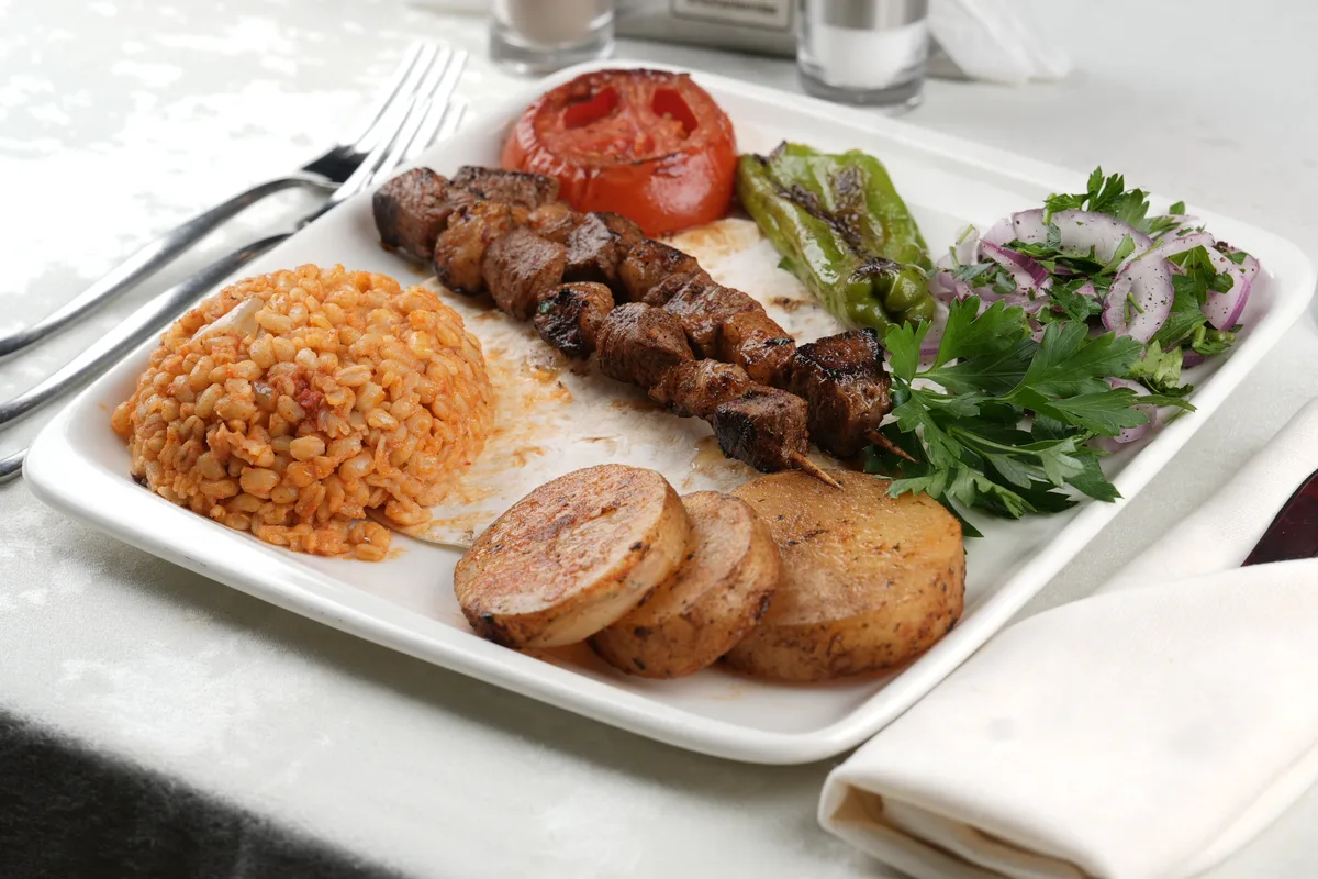 Grilled kebab main course on the AMOR dinner cruise