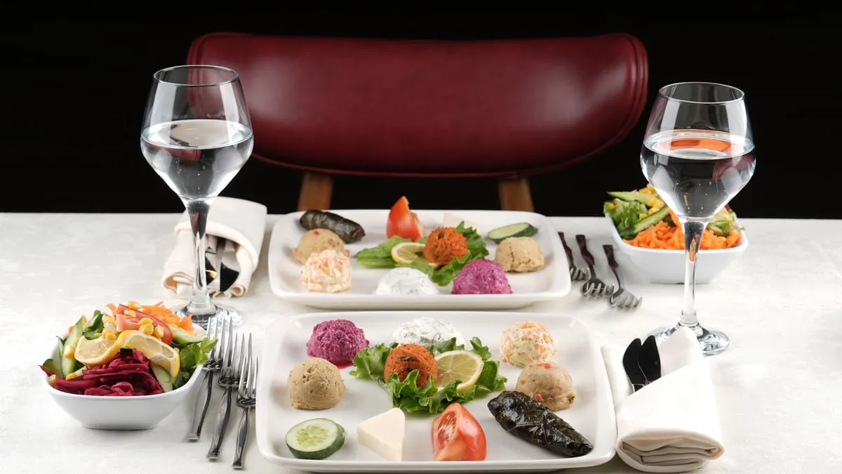 Cold meze selection served at a laid table on the AMOR Bosphorus dinner cruise
