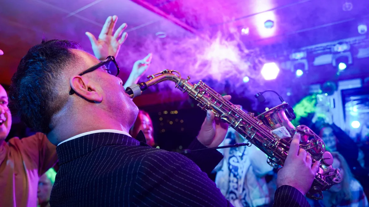 Live saxophone performance on the AMOR dinner cruise